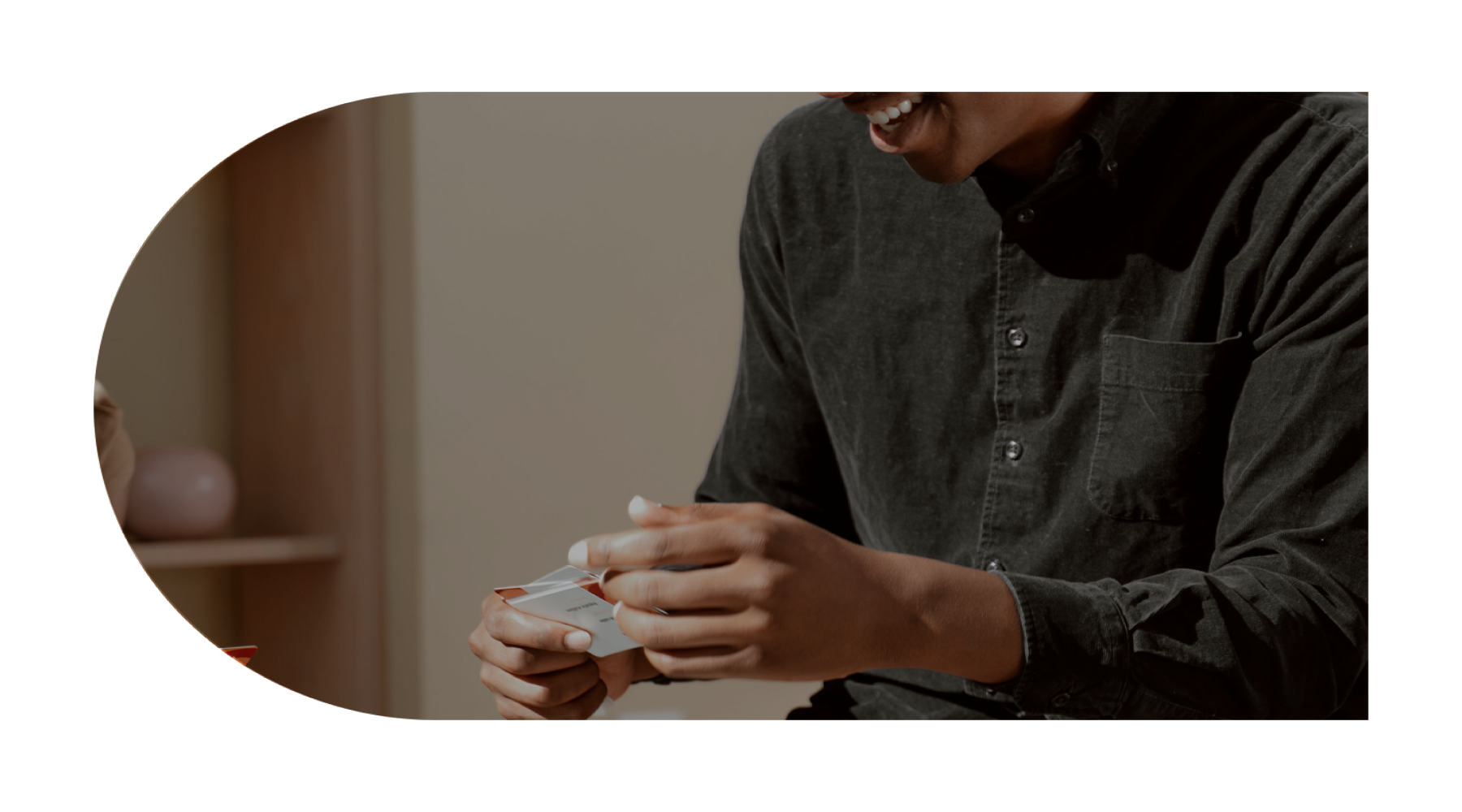 a man holding cards
