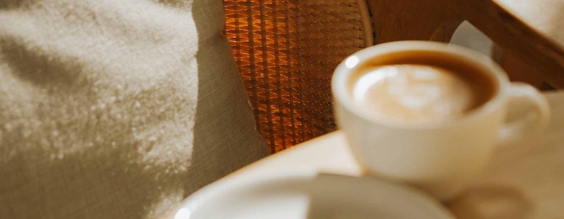 a table with a cup of coffee